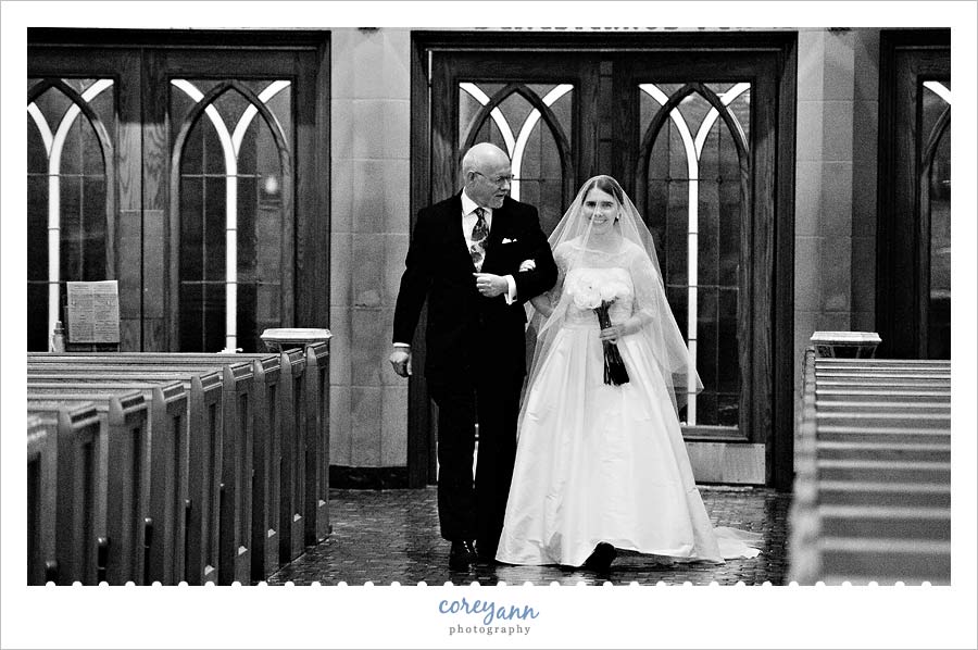 bride walking down aisle at st john the evangelist in cleveland