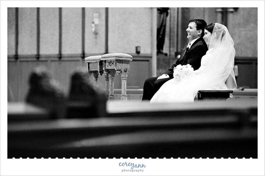 bride and groom during wedding ceremony at st john the evangelist in cleveland