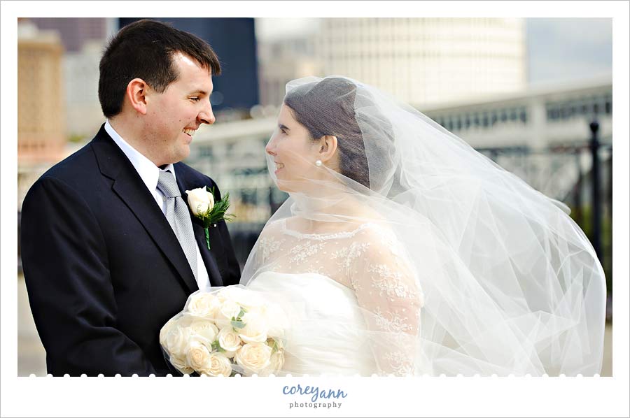 bride and groom with cleveland skyline 