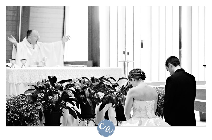 bride and groom during catholic ceremony