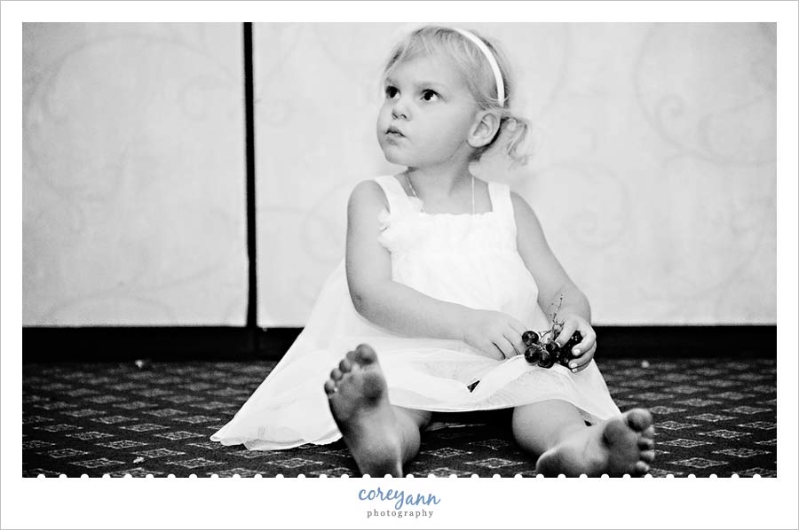 flower girl on the floor with dirty feet at the reception