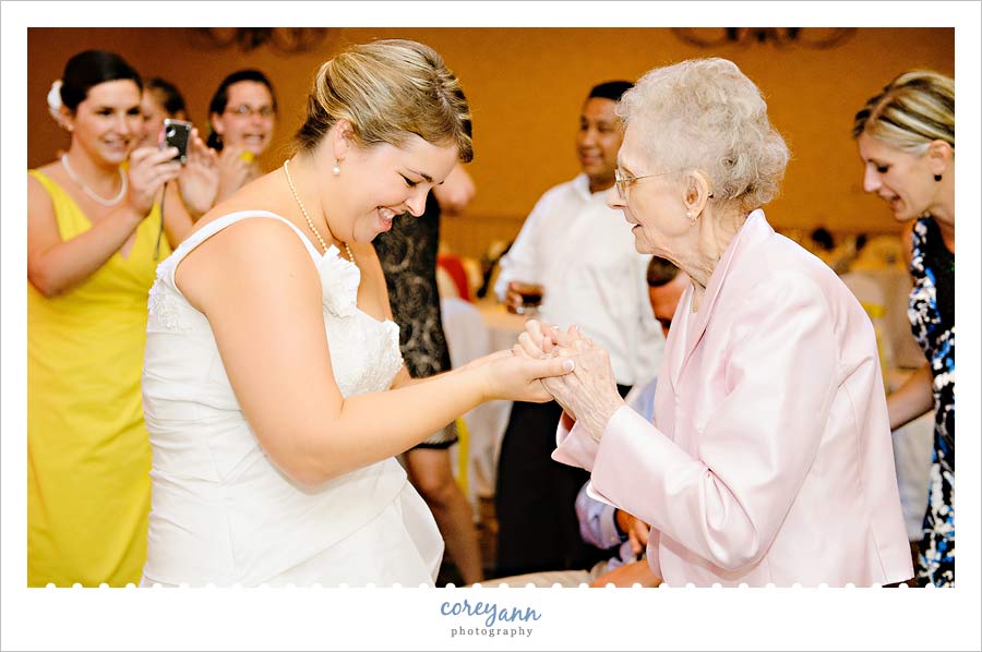 bride dancing with her grandmother at wedding reception