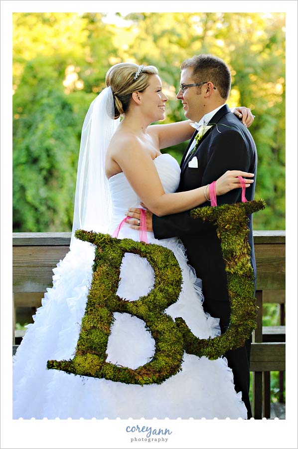 bride and groom with moss initals