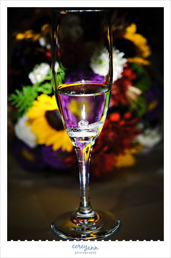 wedding rings in champagne glass 
