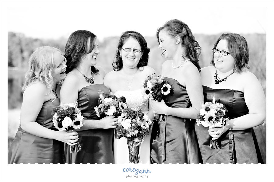 bride and bridesmaids laughing at punderson manor in ohio
