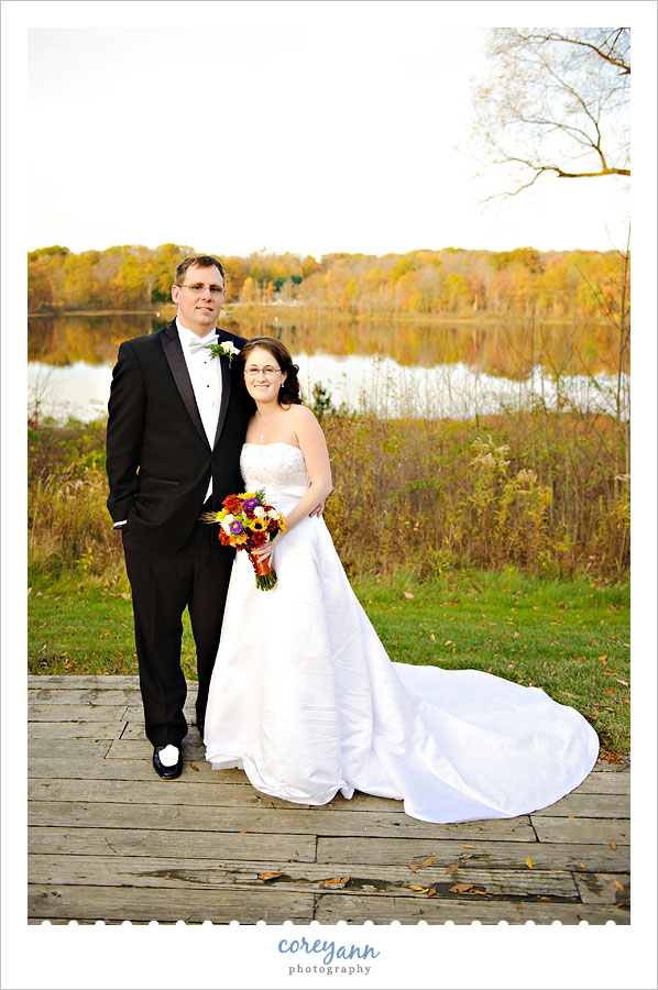 bride and groom during fall at punderson state park