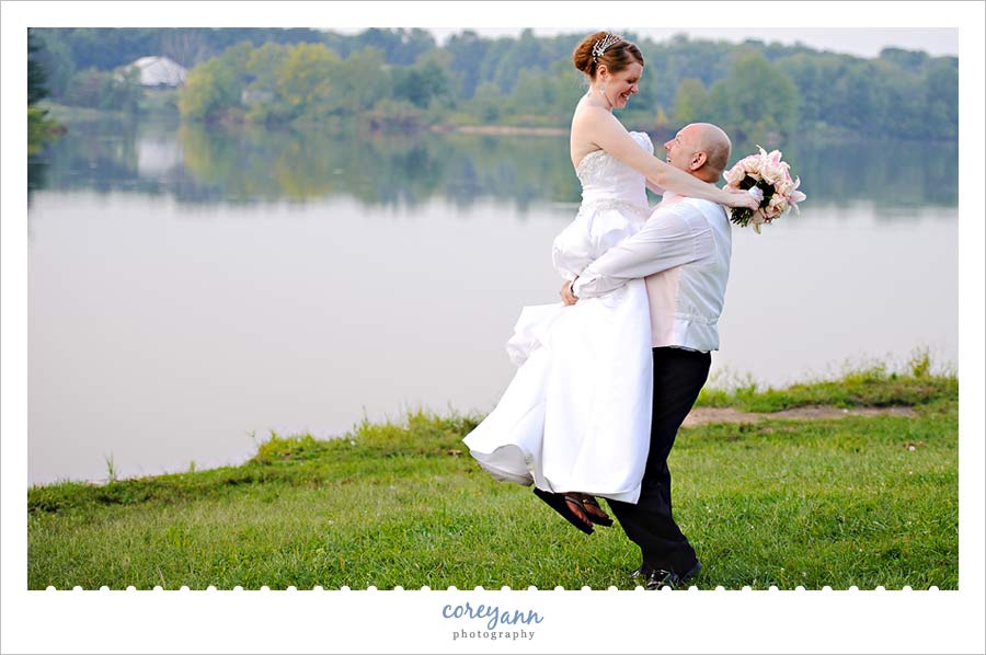 bride and groom near reservoir in alliance