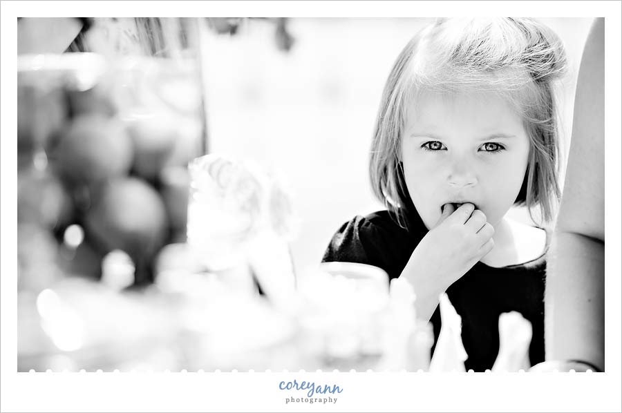 little girl eating candy from a candy buffet in cleveland ohio