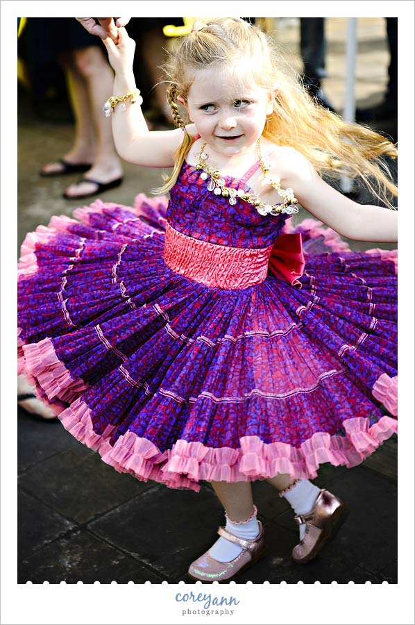 little girl spinning in her tutu dress 