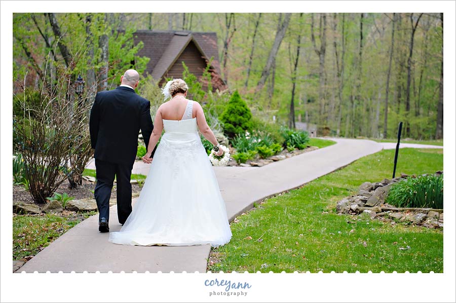 bride and groom walking the grounds at Landoll's Mohican Castle