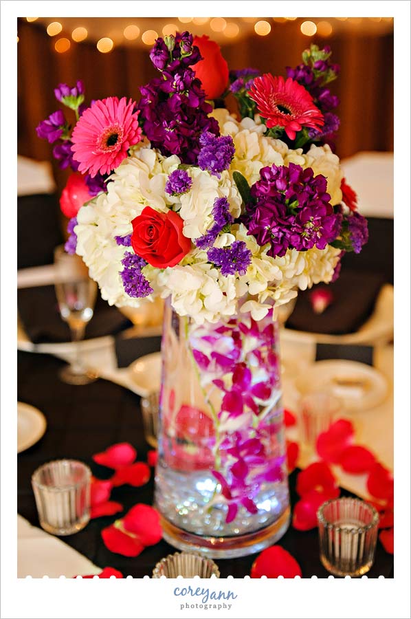 pink purple and white lit centerpiece from wedding at Landoll's Mohican Castle