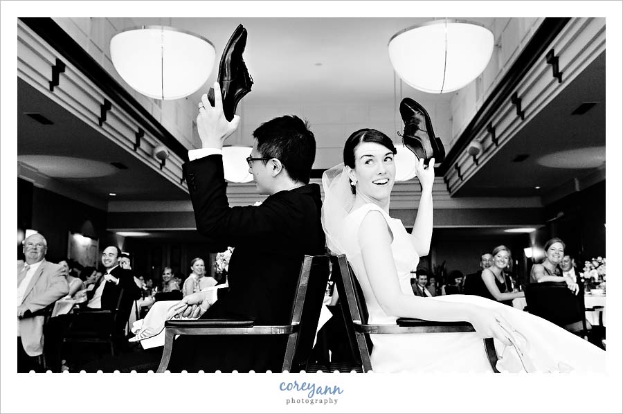 wedding shoe game during reception with bride and groom
