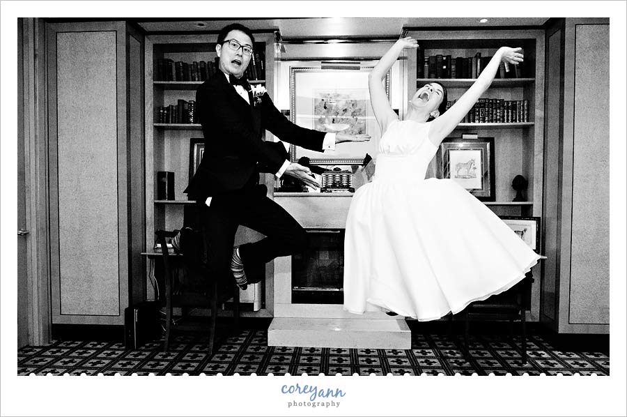 bride and groom jumping 