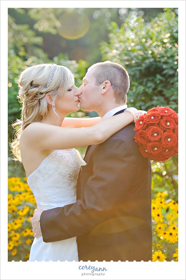 bride and groom kissing at coulby park in wickliffe ohio