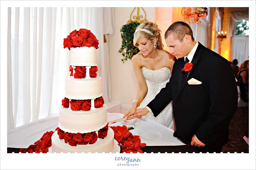 bride and groom cutting cake at reception at pine ridge country club