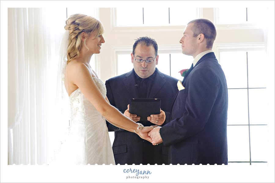 officiant using ipad during ceremony at pine ridge country club