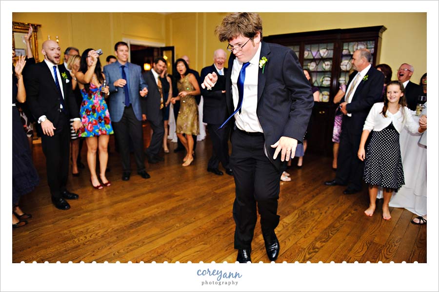groom dancing at reception at Kirtland Country Club