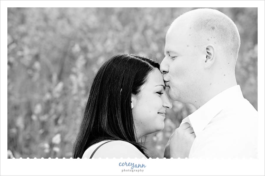 kissing forehead in engagement picture in ohio