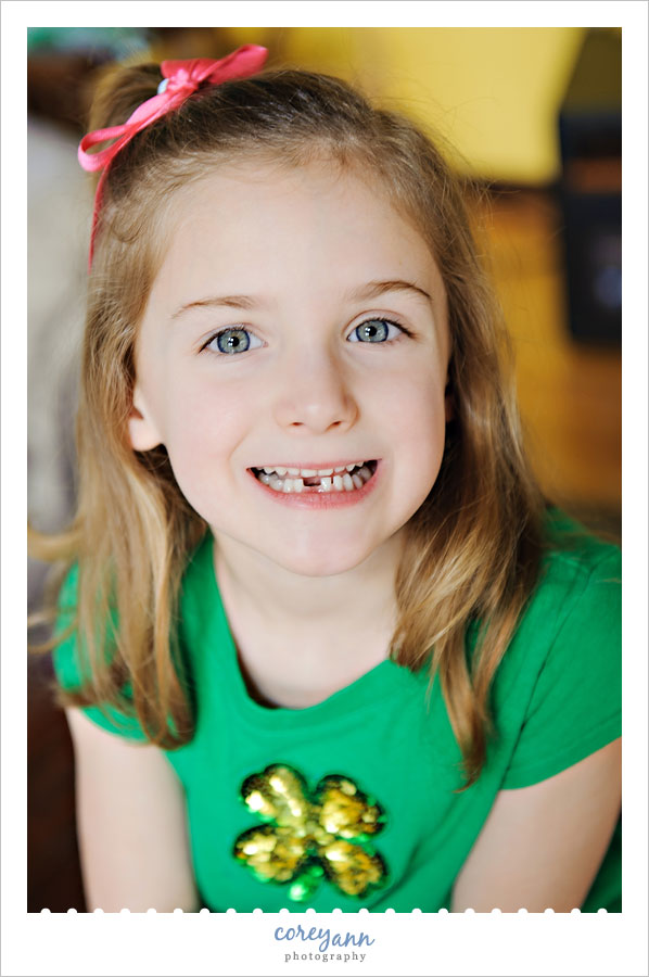 little girl with recently lost tooth 