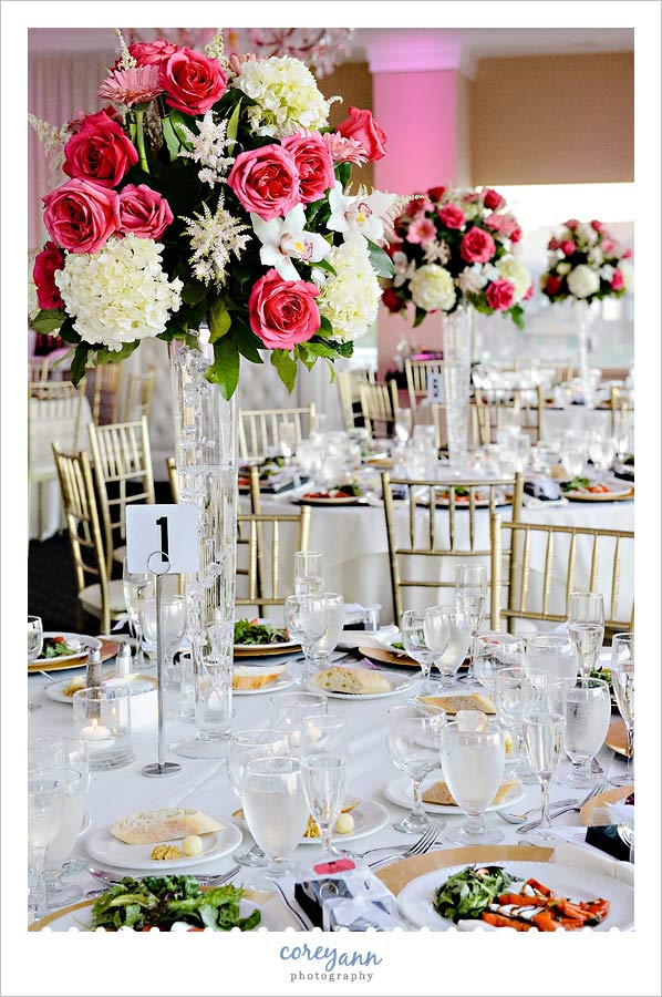 tall hot pink rose centerpieces at waterside restaurant and catering