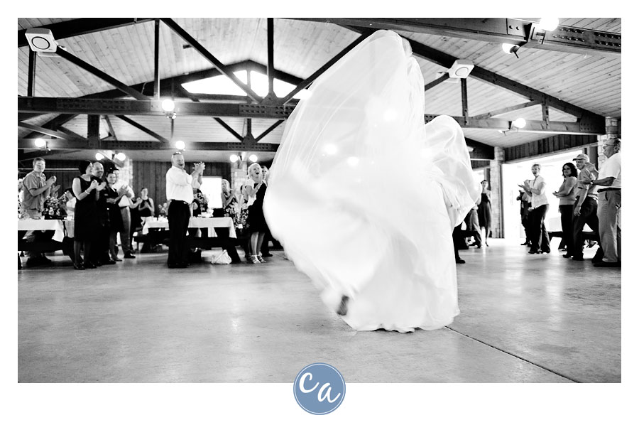 bride doing cartwheel for entrance into reception