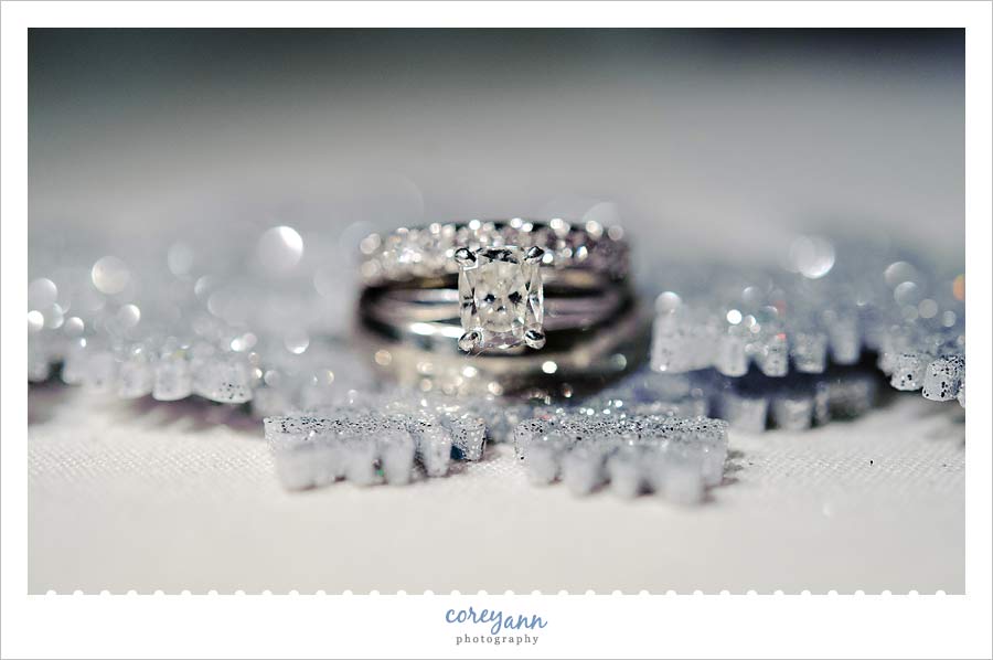 wedding rings on silver snowflakes