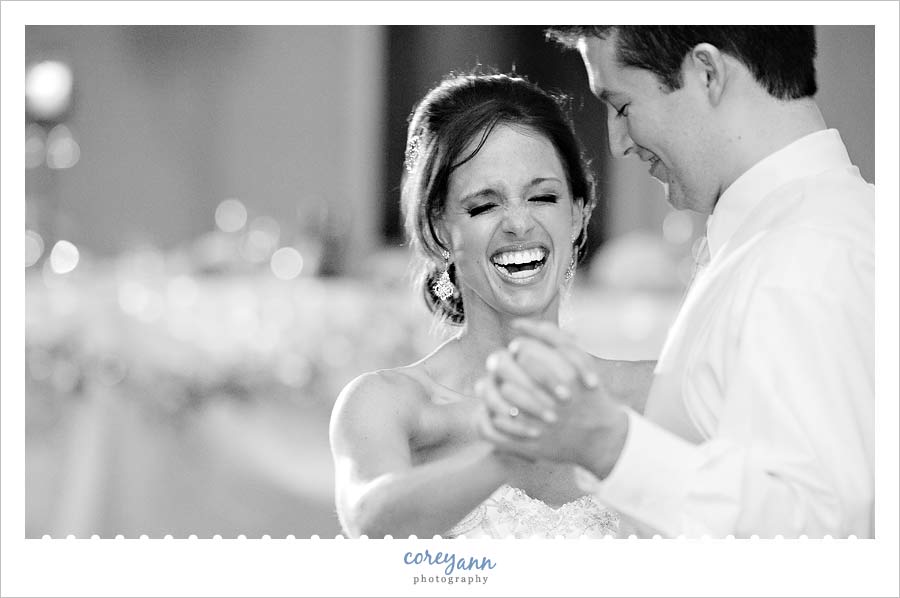 bride laughing during the first dance at reception