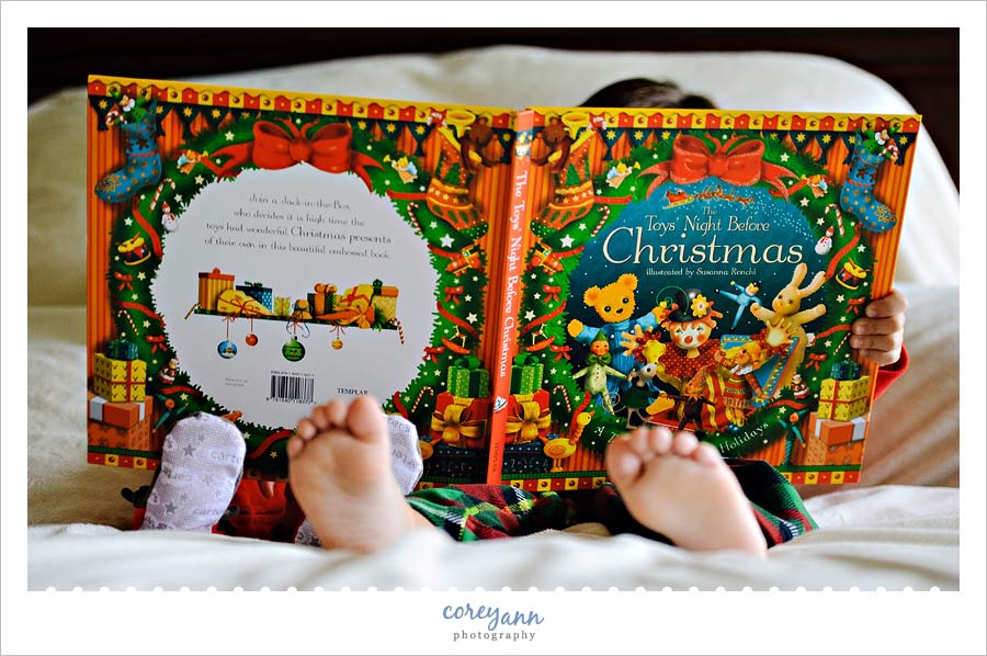 two boys reading a night before christmas in pjs