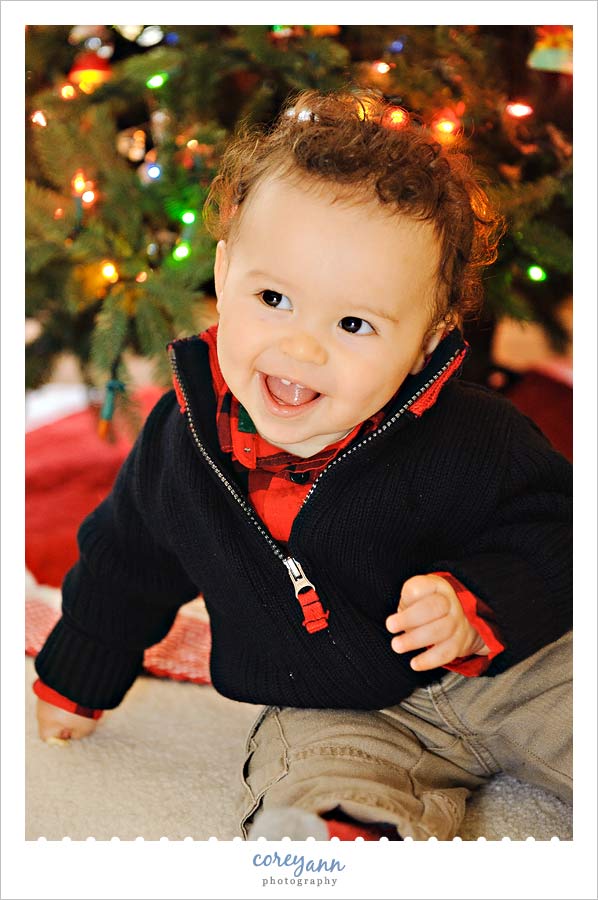 baby portrait in front of christmas tree in avon ohio