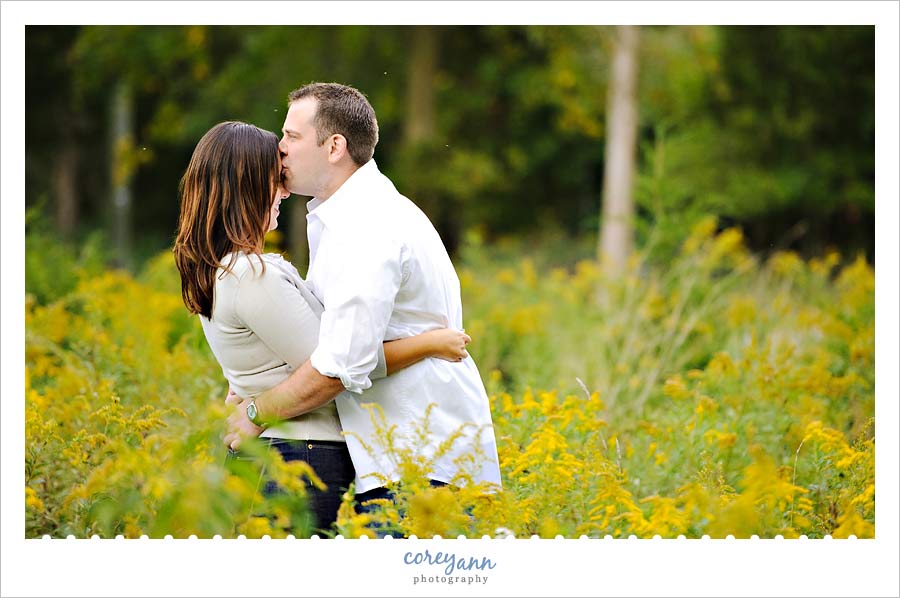 engagement picture in goldenrod field on kelleys island