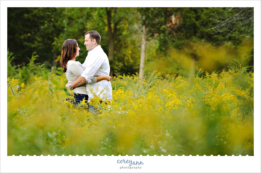 engagement picture in goldenrod field on kelleys island