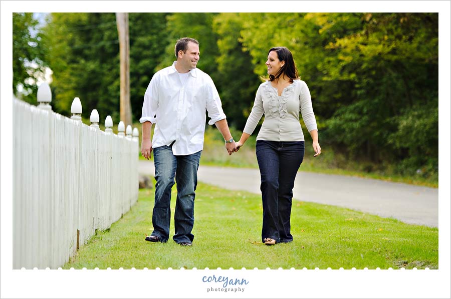 engagement picture by picket fence on kelleys island